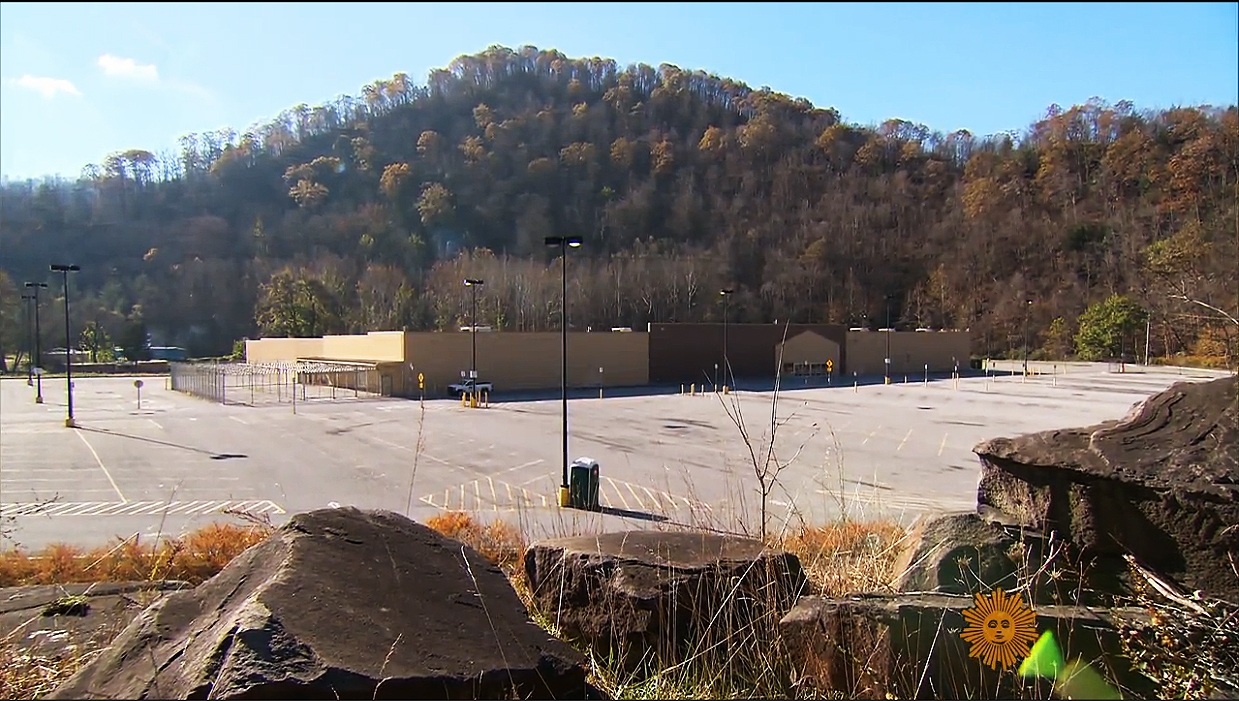 An abandoned Walmart in McDowell County, West Virginia where the population has declined from a high of 100,000 to 19,000 today. Video capture via CBS News.